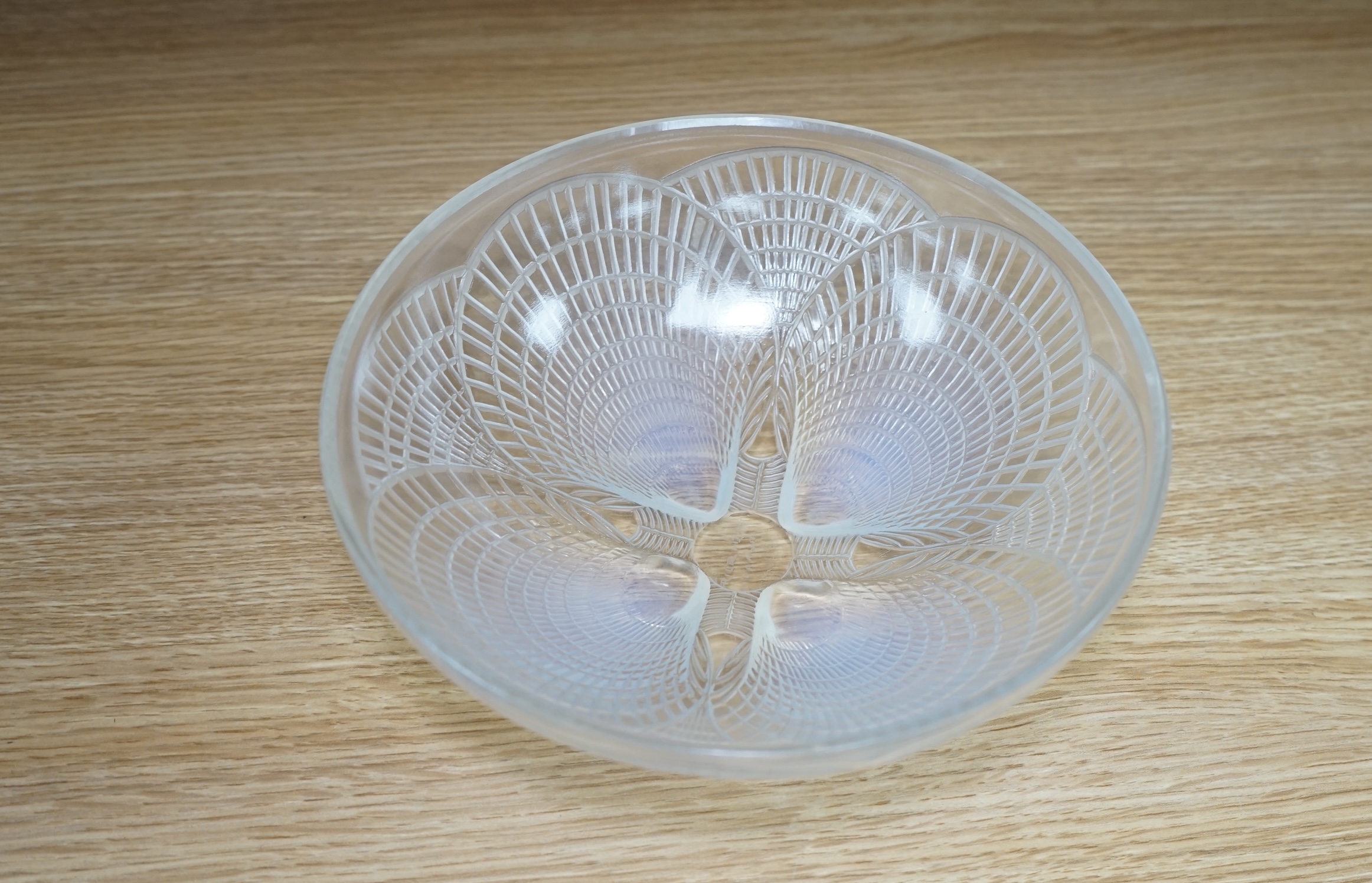 An R. Lalique coquille pattern glass bowl, no.3201, 21cm diameter. Condition - wear to base as expected, otherwise good